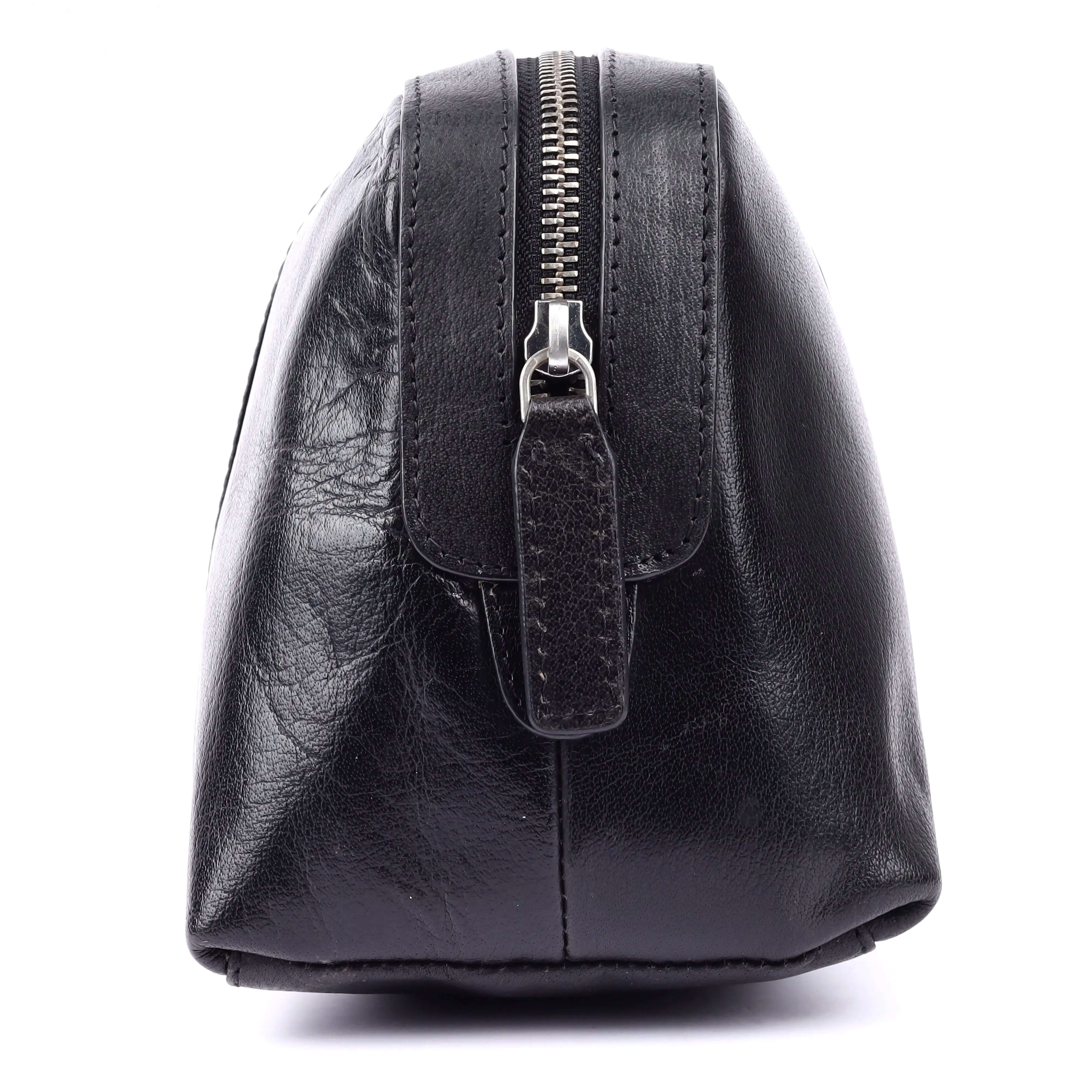 Black leather wash bag side view showcasing modern luxury design for travel organization.