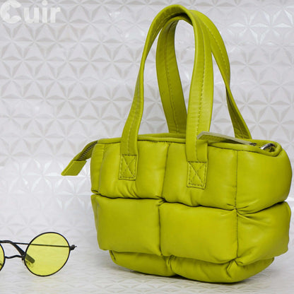 Small lime green leather crossbody bag with handles, stylish compact accessory for fashion-forward individuals.